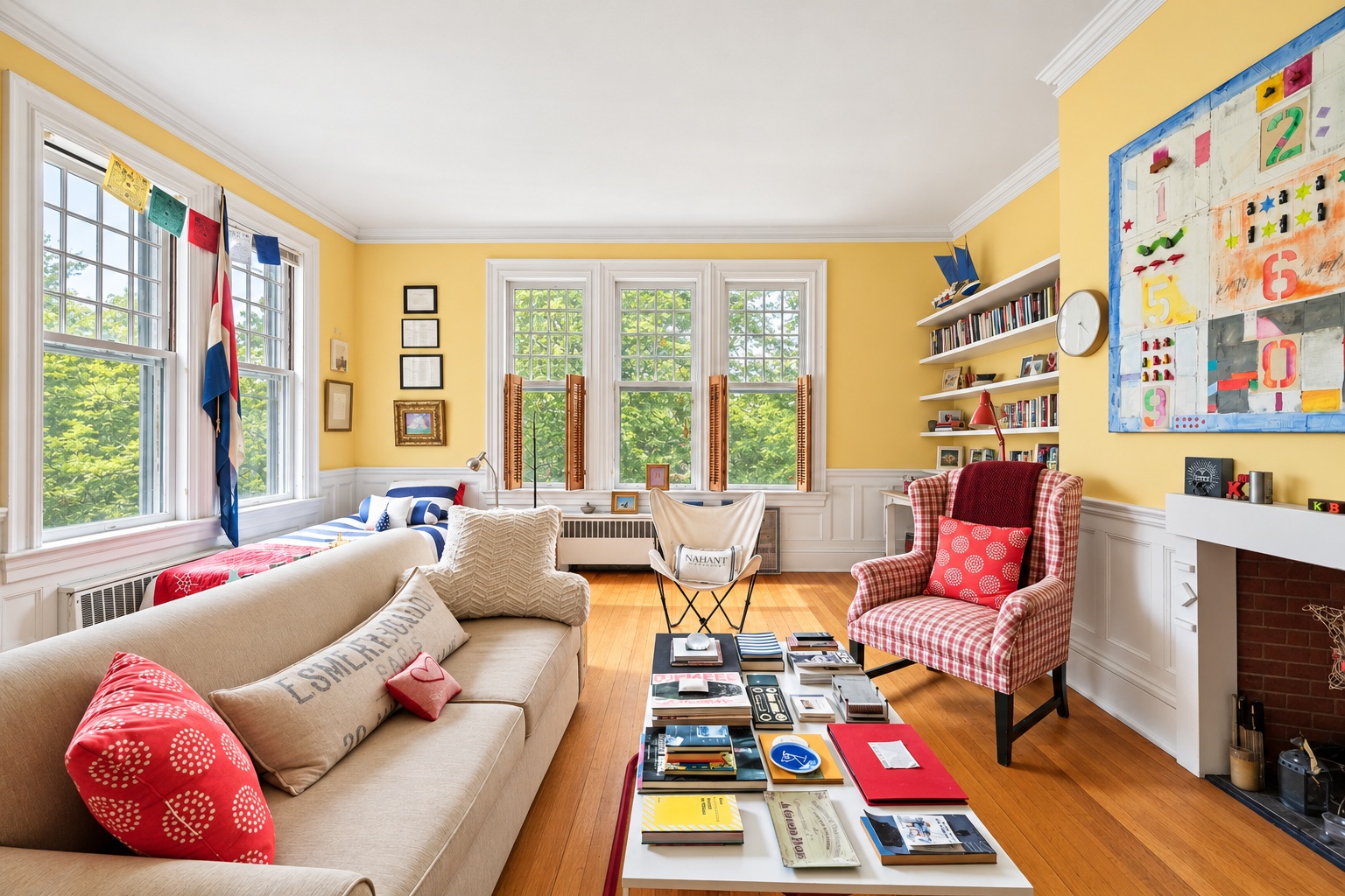 Colorful children’s room with a sofa, books, and garden views